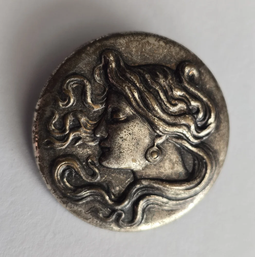 Art Nouveau style brooch woman with flowing hair dark silver tone pin
